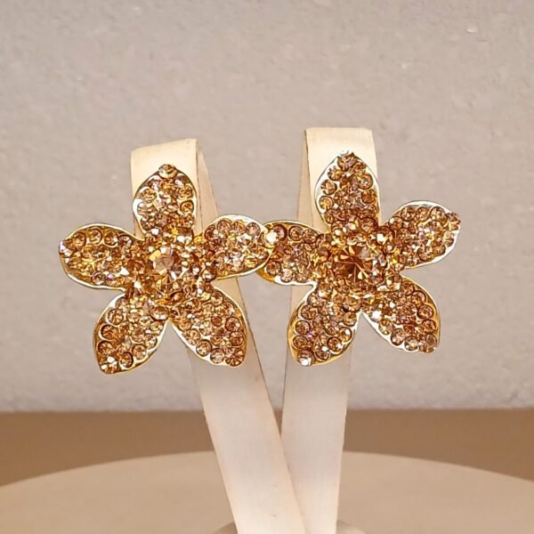 Brinco dourado flor stress - 5230